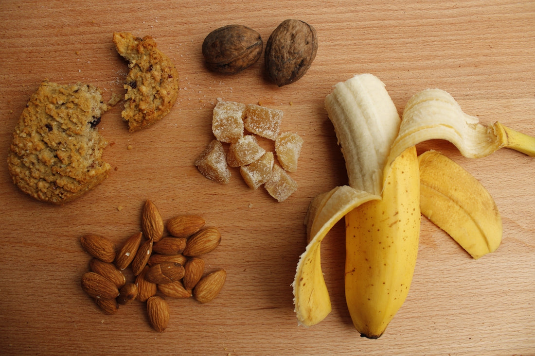 sliced banana and brown nuts on brown wooden table